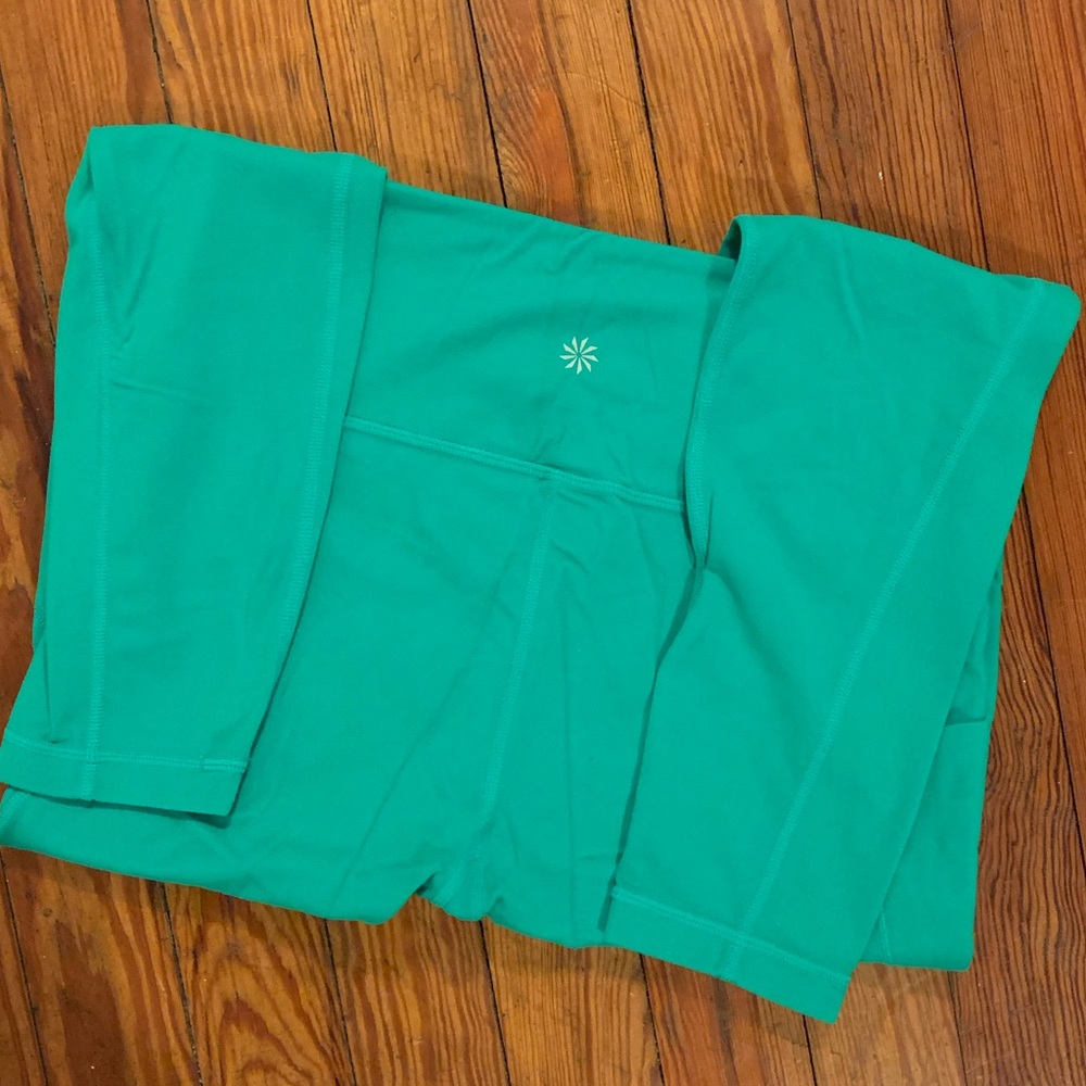 Athleta stash pocket salutation tights